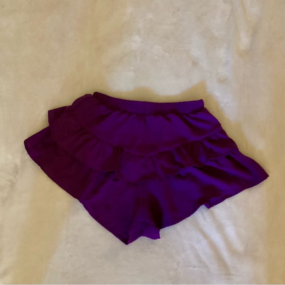 Purple ruffled shorts with a little skirt look . SIZE SMALL WOMANS
